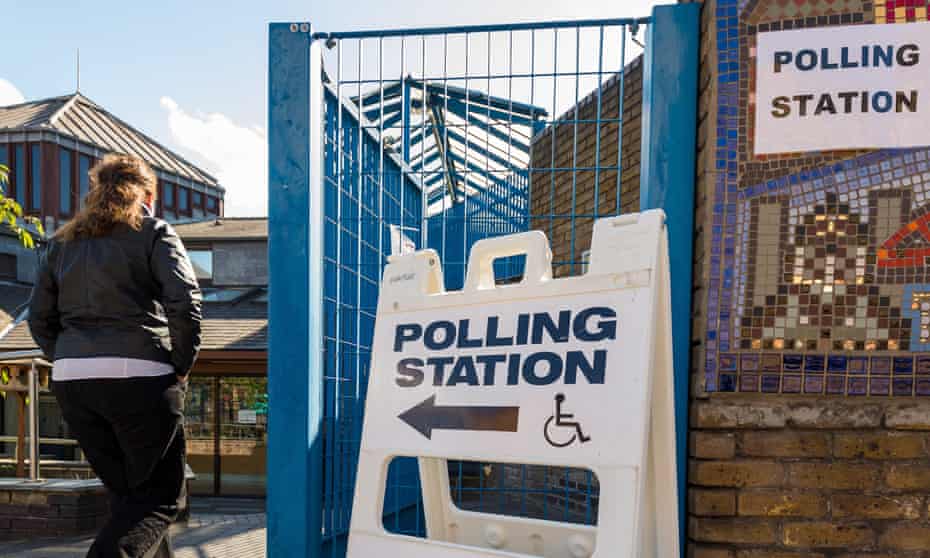 A woman arrives at a polling station