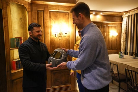 Heraskevych gives Zelenskyy the helmet of memory.