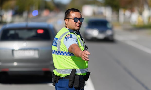 Easter Weekend Checkpoints In Place As New Zealanders Are Told To Stay Home For Easter During Coronavirus LockdownAMBERLEY, NEW ZEALAND - APRIL 10: A police officer stops cars travelling north towards Hanmer Springs at a checkpoint on April 10, 2020 in Amberley, New Zealand. With New Zealand in lockdown due to COVID-19, police are setting up checkpoints across the country to ensure people on the roads are travelling for essential purposes only. The Easter long weekend is a popular time for New Zealanders to go on holiday, however current Level 4 restrictions in place due to the coronavirus (COVID-19) pandemic requires everyone to remain at the place of residence they were in as of midnight 25 March when New Zealand went into lockdown. (Photo by Kai Schwoerer/Getty Images)