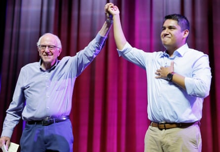 two men with their hands up