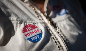 A voter wears her voting sticker outside a polling location for the 2016 US presidential election.