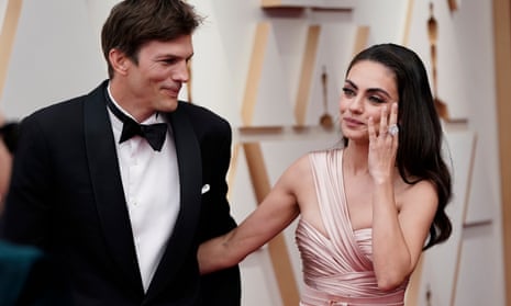 Ashton Kutcher and Mila Kunis arrive at the Oscars on 27 March 2022, at the Dolby Theatre in Los Angeles.