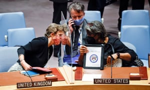 The UK ambassador to the UN, Barbara Woodward, and the US ambassador to the UN, Linda Thomas-Greenfield, talk while the Ukraine ambassador to the UN, Sergiy Kyslytsya, speaks on his phone after an emergency meeting at the UN headquarters in New York