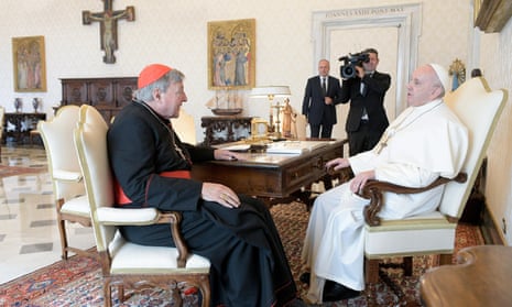 Pope Francis speaks with Cardinal George Pell in Vatican City on 12 October