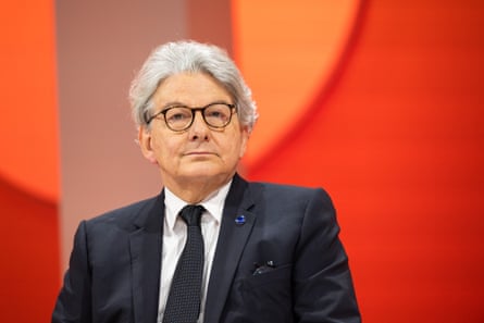 Thierry Breton on a stage in a dark suit