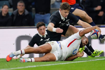 England’s Ollie Lawrence scores his side’s first effort against New Zealand