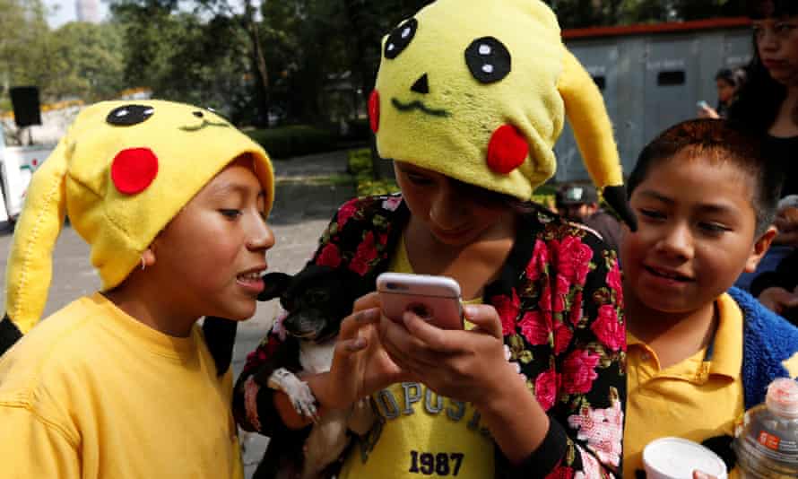 Children dressed as Pikachu play Pokemon Go in Mexico City on 21 August 2016.