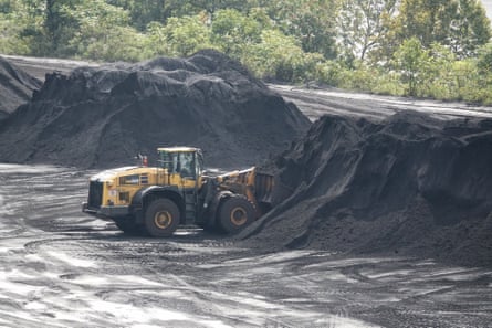 A vehicle pushes coal
