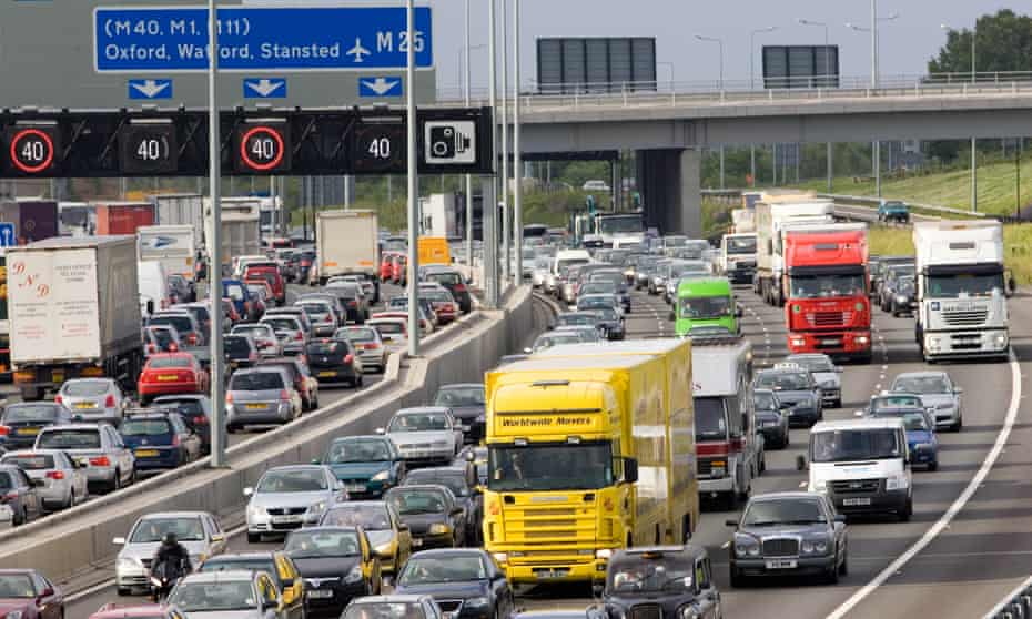 Traffic congestion in both directions on the M25 motorway, London.