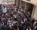 A large crowd of people on a street.