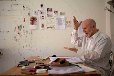 Brett Dean very animated at a table working on a score