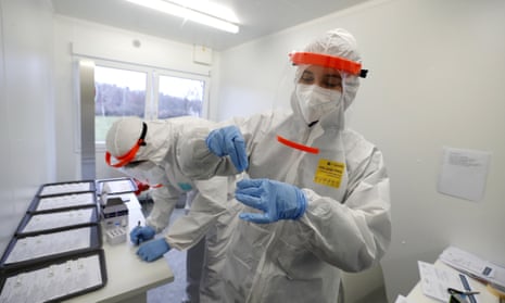 Medical workers examine antigen tests for the coronavirus in Prague, Czech Republic.