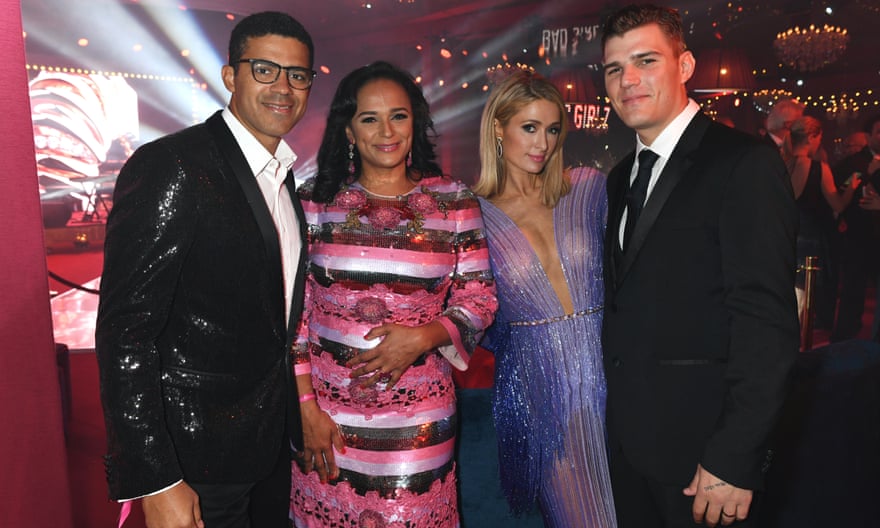 Sindika Dokolo and Isabel dos Santos pose with Paris Hilton and Chris Zylka at a De Grisogono party during the 2018 Cannes film festival