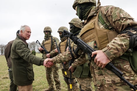 King Charles III meets with Ukrainian recruits in Wiltshire.
