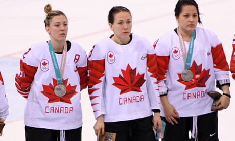 Larocque (centre) removed her medal and held it in her hand during the ceremony on Thursday