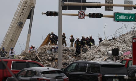 Search and Rescue teams look for possible survivors in the collapsed 12-story Champlain Towers South.