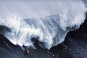 A bodyboarder rides a wave during a big-wave surfing session