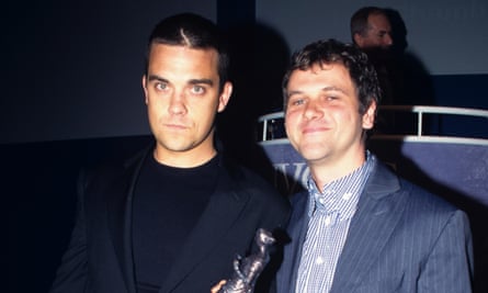 Long-term songwriting partnerships such as that of [L-R] Robbie Williams and Guy Chambers could offer one solution to the trials facing songwriters.