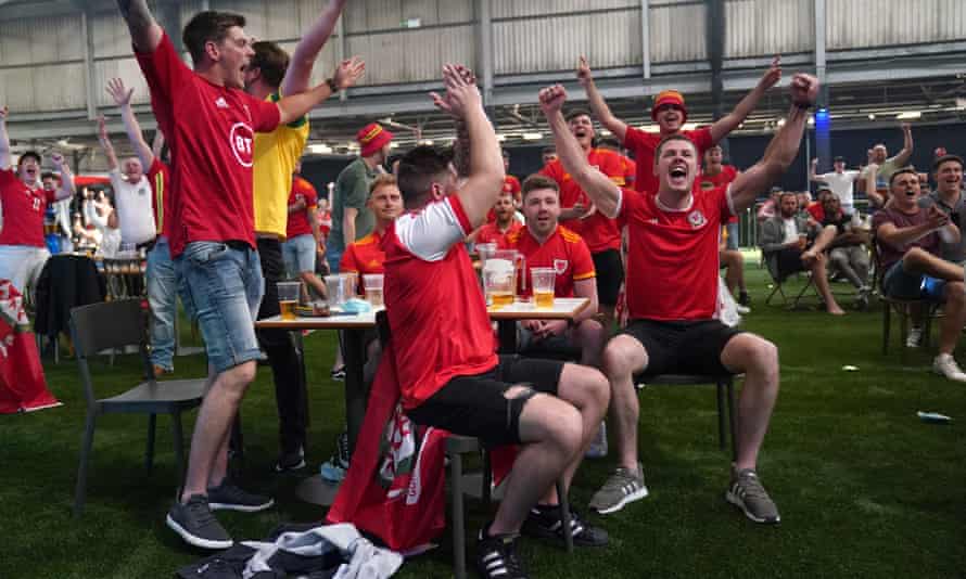 Wales fans enjoy the moment at a fanzone in Cardiff where many will gather again for Wednesday night’s crucial Group A game against Turkey.