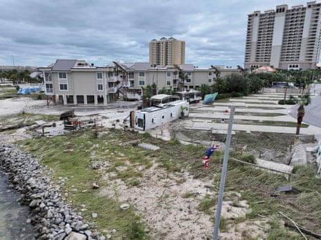 debris outside of homes by water