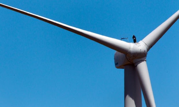A technician stands on a wind turbine nacelle at Capital Wind Farm in Bungendore, Australia, on Wednesday, Dec. 22, 2010.