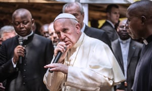 Pope Francis gestures as he gives his blessing during a visit to an internally displaced people camp at St Saviour parish in Bangui – in an image that has sparked a new career in hip-hop.