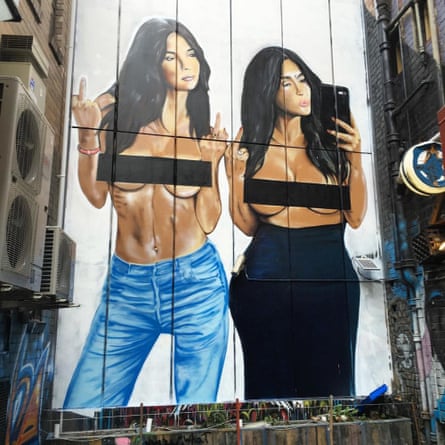 Mural of Kim Kardashian posing topless with model Emily Ratajkowski, painted by Melbourne street artist Lushsux on Sniders Lane in Melbourne, Australia.