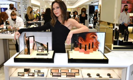Victoria Beckham poses with a display of Victoria Beckham Beauty products at Bergdorf Goodman in New York