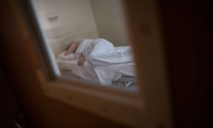 A patient who recovered from the COVID-19 lays in bed at the psychiatric hospital “EPS de Ville Evrard, Centre psychiatrique du Bois de Bondy”