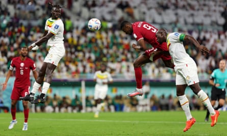 Mohammed Muntari climbs above the Senegal defence to head Qatar’s first-ever World Cup goal