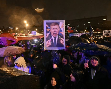 A demonstrator holds a picture depicting Prime Minister Robert Fico being scared of chalk during a protest against the government of Slovakia's nationalist prime minister Robert Fico in Bratislava, Slovakia.