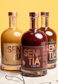 Three bottle of different colours of Sentia – gold, red and black