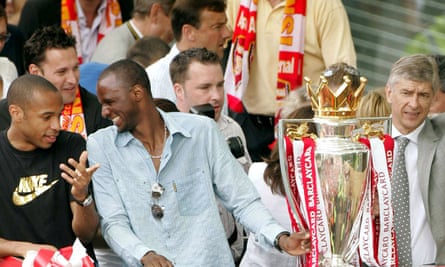 Patrick Vieira with Thierry Henry and Arsène Wenger during a victory parade to celebrate winning the 2003-04 Premier League title with an unbeaten record