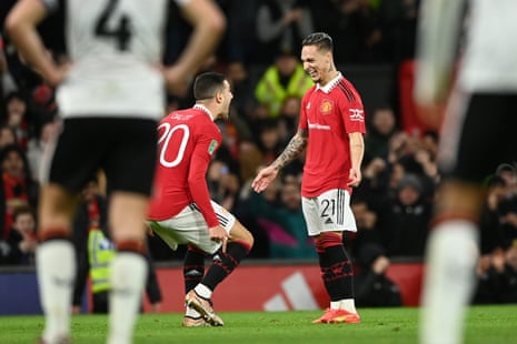 Antony of Manchester United celebrates with teammate Diogo Dalot after scoring their team's first goal.
