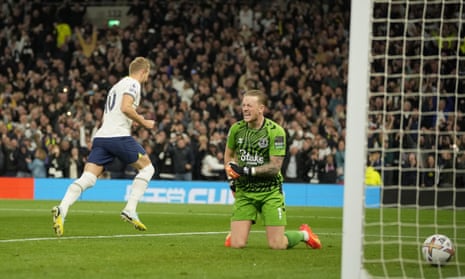 Tottenham's Harry Kane celebrates after scoring the opening goal from the penalty spot past Everton's goalkeeper Jordan Pickford.