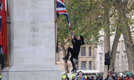Charlie Gilmour climbing the Cenotaph, a memorial to those who died in the first world war.