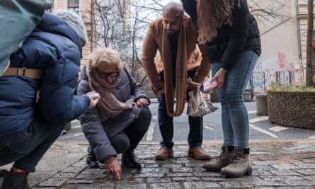 A group of Berliners at a Stolpersteine cleaning initiative.