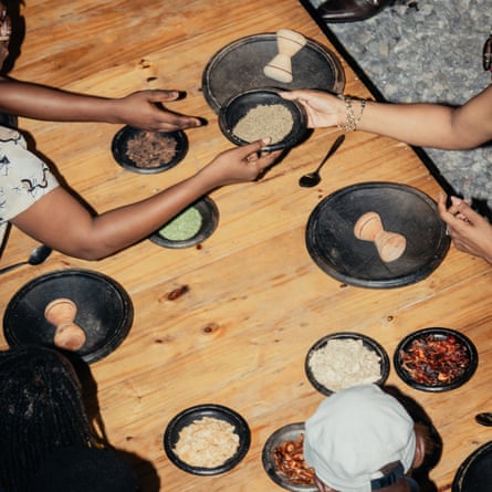 Table seen from above with hands passing bowls