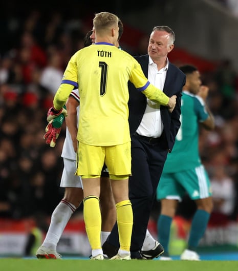 Hungary goalkeeper Balasz Toth greets Northern Ireland manager Michael O'Neill following the match.