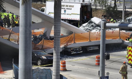 Multiple Fatalities Reported After Collapse Of Pedestrian Bridge In Miami<br>MIAMI, FL - MARCH 15: Vehicles are seen trapped under the collapsed pedestrian bridge that was newly built over southwest 8th street allowing people to bypass the busy street to reach Florida International University on March 15, 2018 in Miami, Florida. Reports indicate that there are an unknown number of fatalities as a result of the collapse, which crushed at least five cars. (Photo by Joe Raedle/Getty Images)