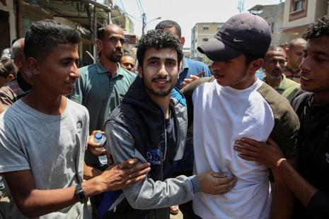 Ahmed Jondeya, a newly released Palestinian who was detained by the Israeli army, is greeted by people, in Rafah in the southern Gaza Strip on Thursday.
