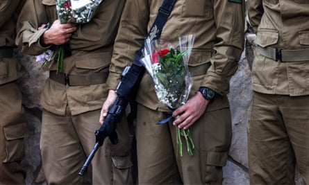 Comrades of French-Israeli soldier Eli Valentin Ghenassia during his funeral in the Mount Herzl cemetery in Jerusalem.