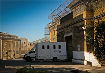 A high-security white Serco van backs into Wandsworth prison.