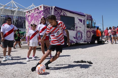 A United States fan plays in the fan zone outside Inter&Co Stadium before Saturday’s international friendly against Peru in Orlando.