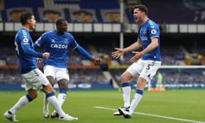 Keane celebrates with Doucoure and James