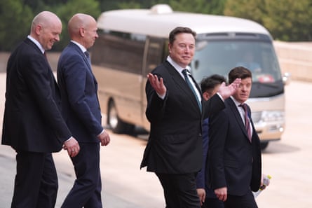 Elon Musk, center, departs after a welcome ceremony with Trump and China’s president, Xi Jinping, in Beijing this month.