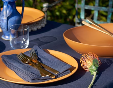close-up of navy and terracotta outdoor tablescape