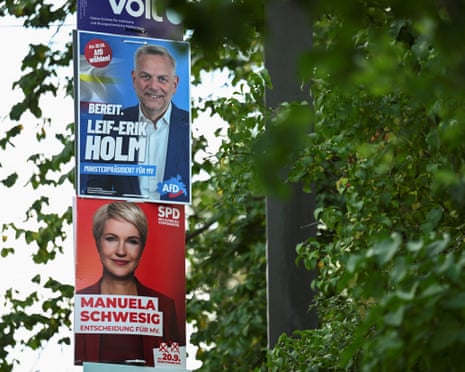 Campaign posters of Leif-Erik Holm, candidate of the far-right Alternative for Germany (AfD), and of Mecklenburg-Western Pomerania State Premier Manuela Schwesig, a Social Democratic party (SPD) candidate, hang on a street lamp, ahead of the Mecklenburg-Western Pomerania state elections in Schwerin, Germany.
