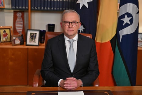 Australian prime minister Anthony Albanese seated in his office in a pre-recorded address to the nation.