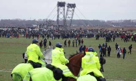 Protesters advance across field